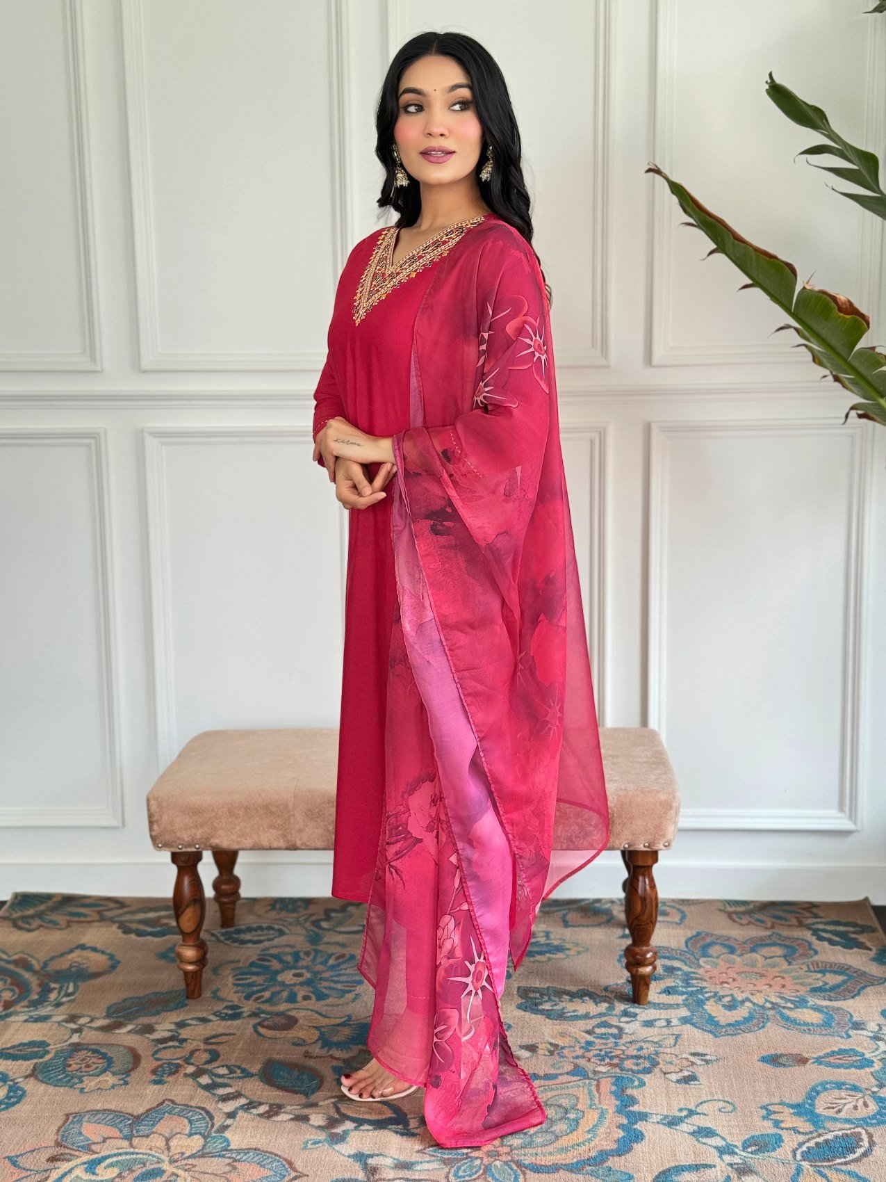 Red kurta set styled with the printed silk dupatta over the shoulder