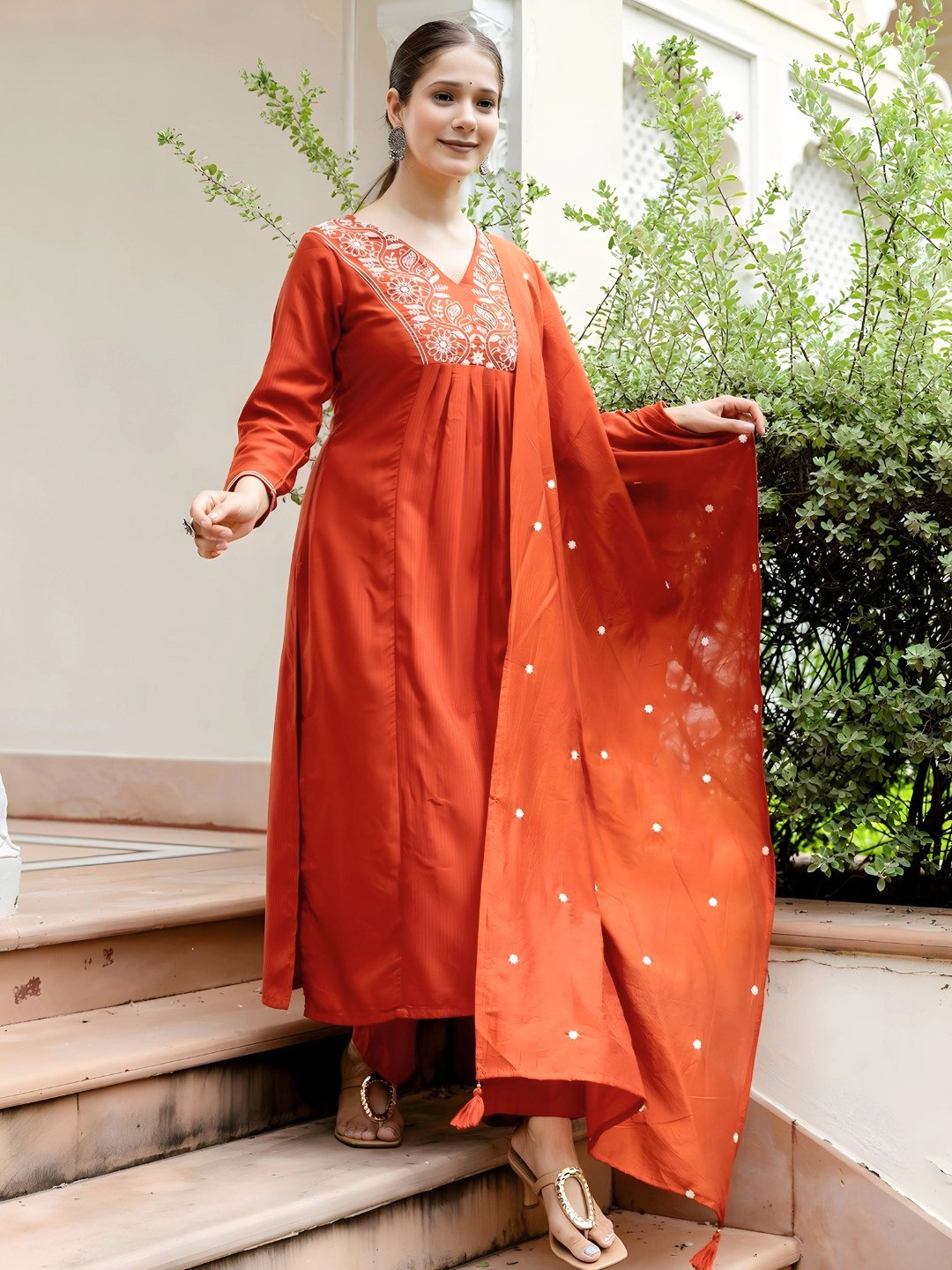 The Chanderi dupatta with scattered butti held open beside the rust kurta
