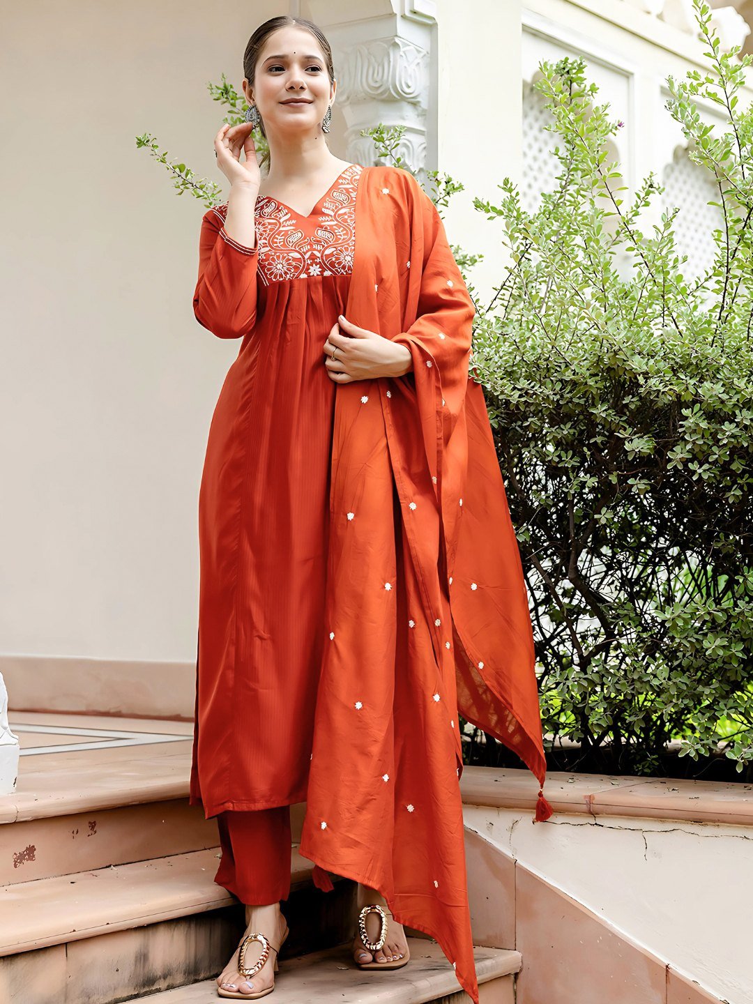 Side view of the rust kurta set with the Chanderi dupatta draped
