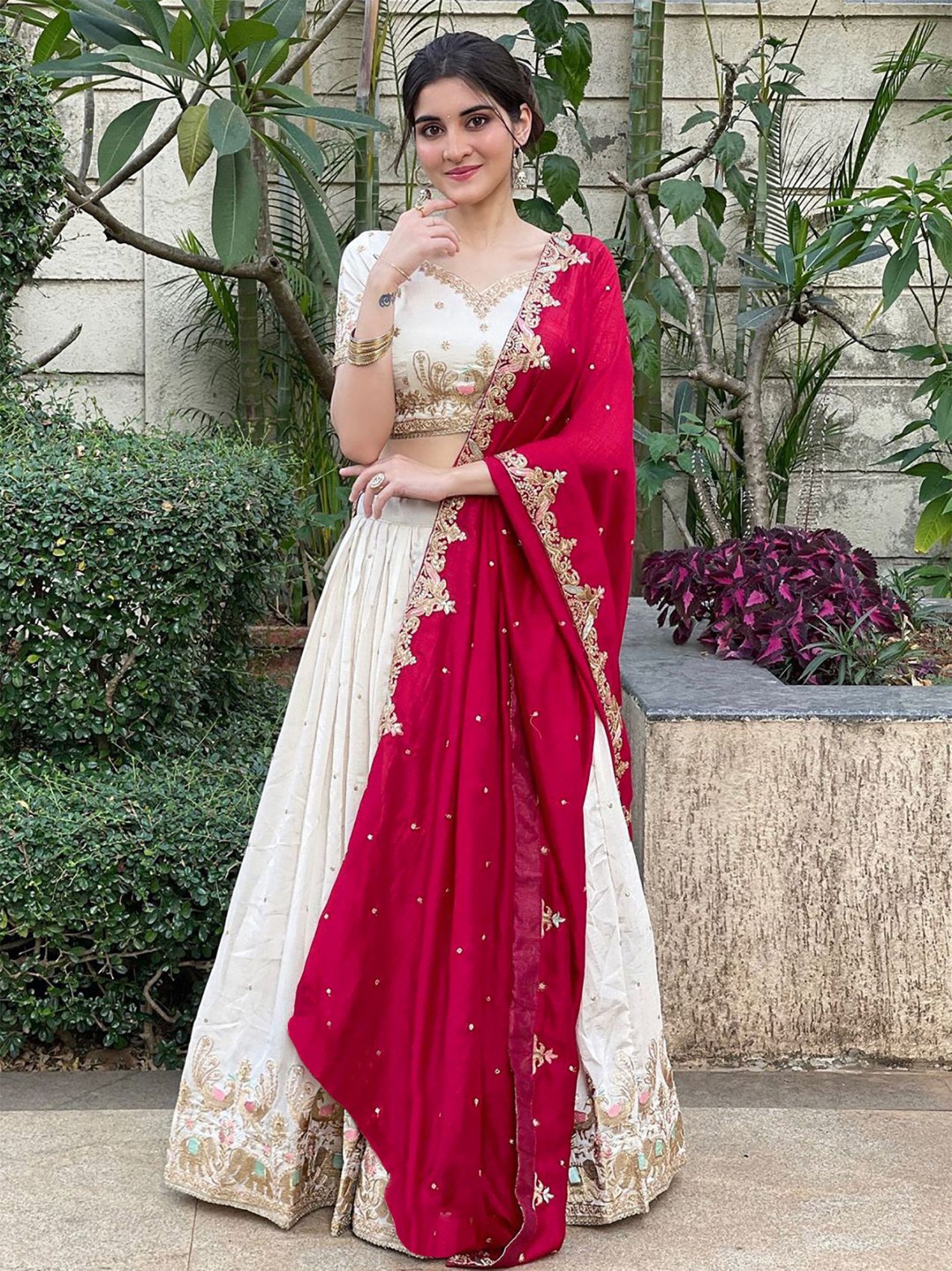 Ivory zari embroidered Chinon semi-stitched lehenga choli set with red dupatta, front view showing the lehenga flair