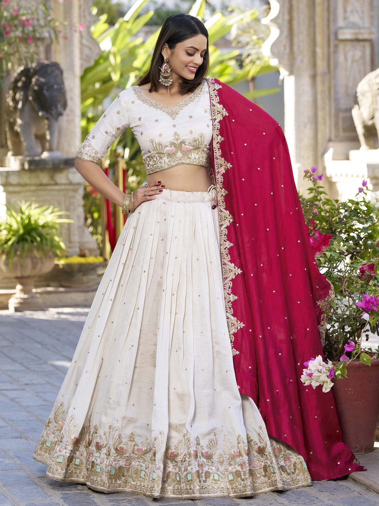 Ivory zari embroidered Chinon semi-stitched lehenga choli set with red dupatta, front view