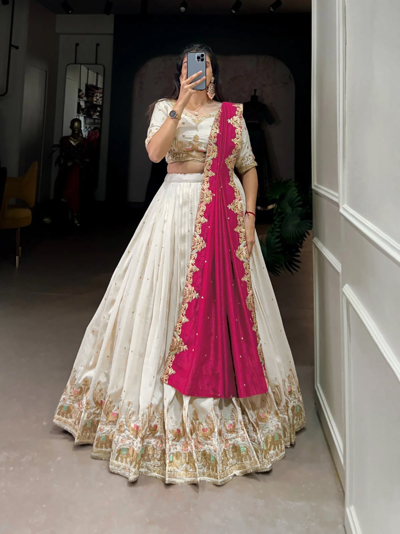 Ivory zari embroidered Chinon semi-stitched lehenga choli set with red dupatta, full-length view with the contrast red dupatta