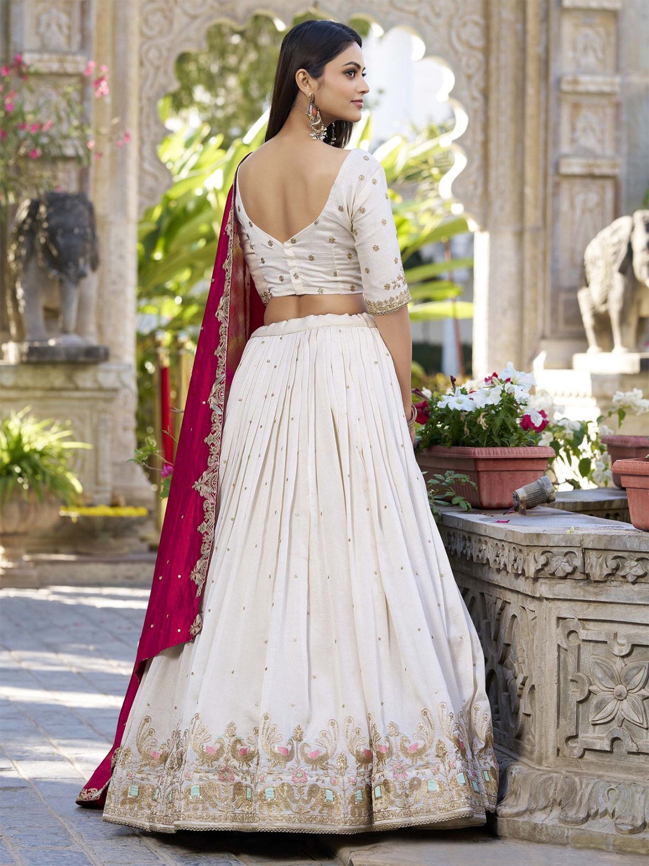 Ivory zari embroidered Chinon semi-stitched lehenga choli set with red dupatta, styled with the dupatta draped over one shoulder