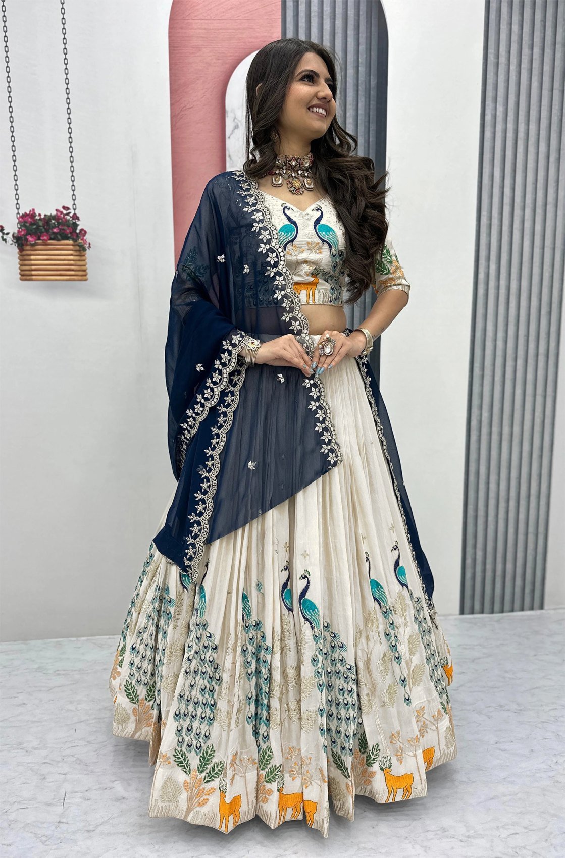 Ivory Chinon semi-stitched lehenga with deer motifs and navy embroidered dupatta, front view