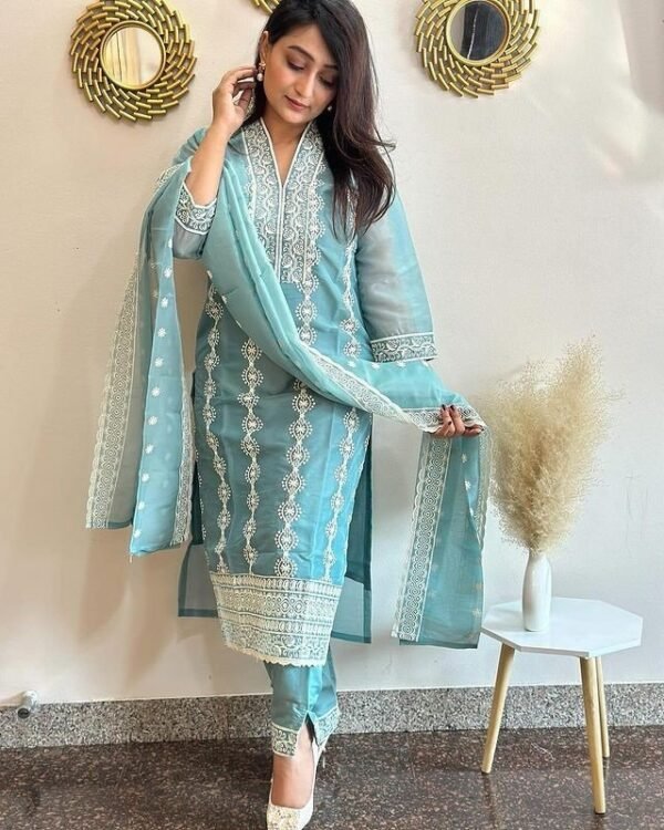 Model wearing the sky blue embroidered Vichitra kurta, pant & dupatta set, front view