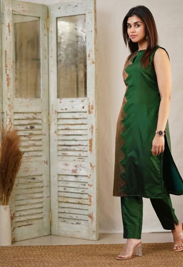 Model wearing the green art Silk sleeveless kurti, pant & dupatta set, front view