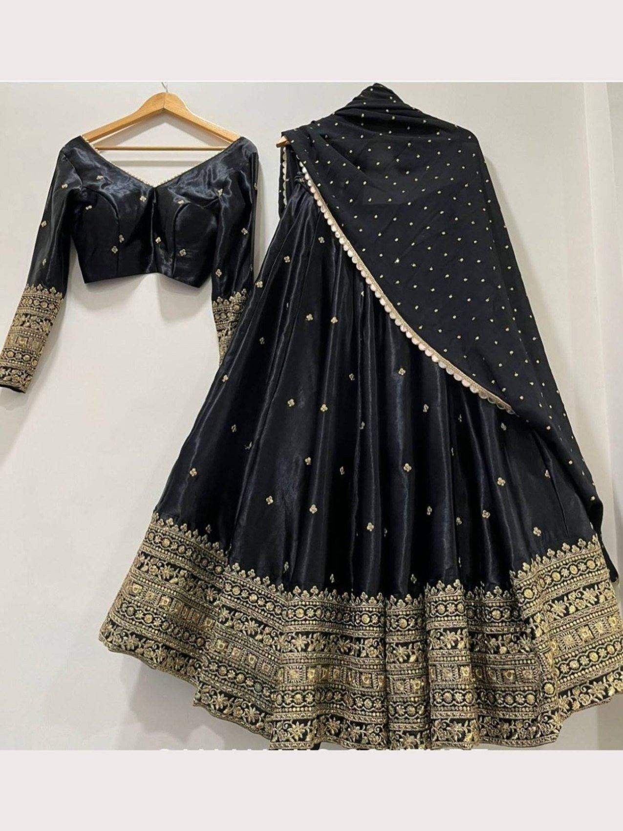 Black semi-stitched Chinon lehenga choli with embroidered dupatta, front view