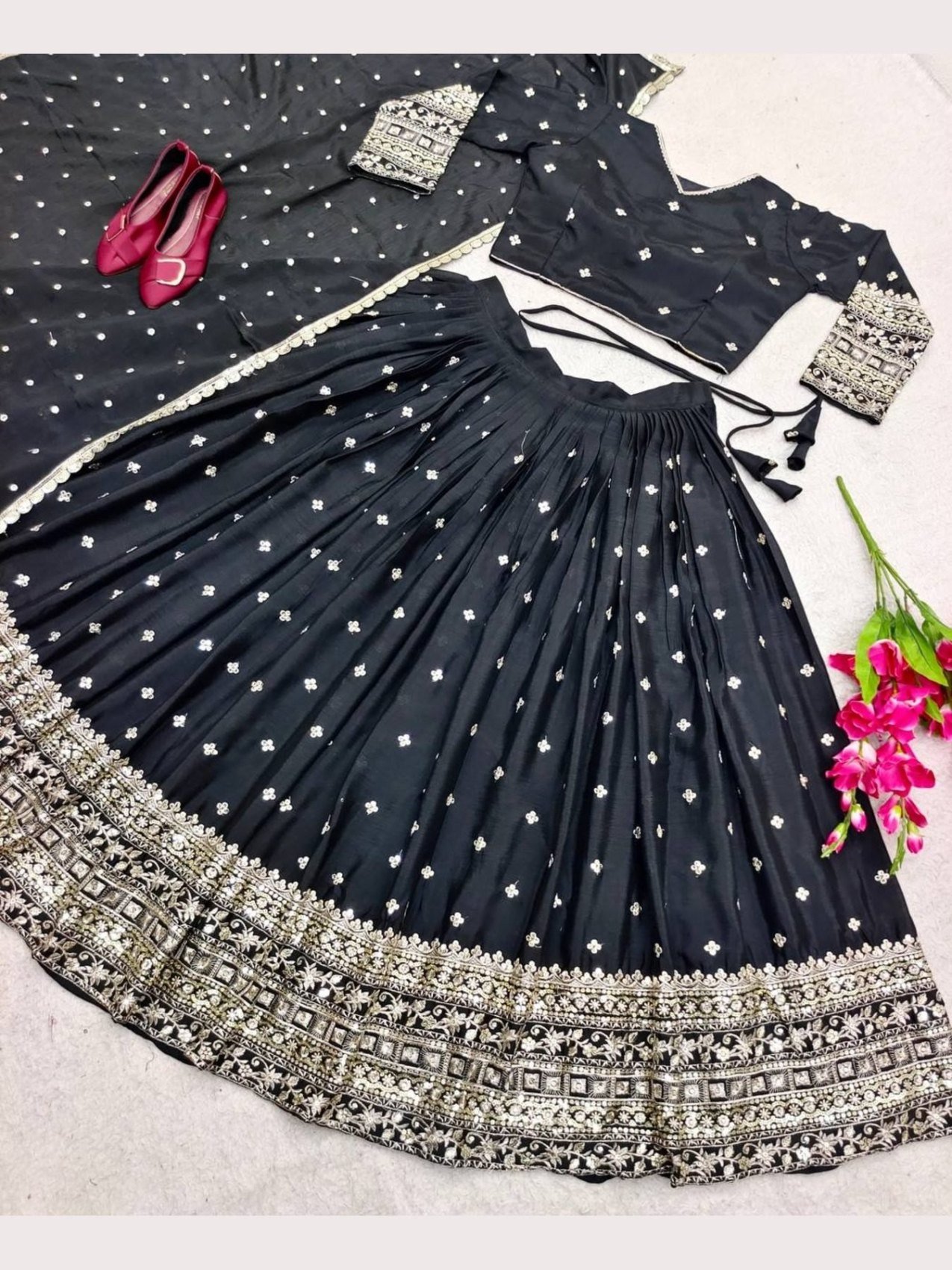 Black lehenga choli set styled with the dupatta