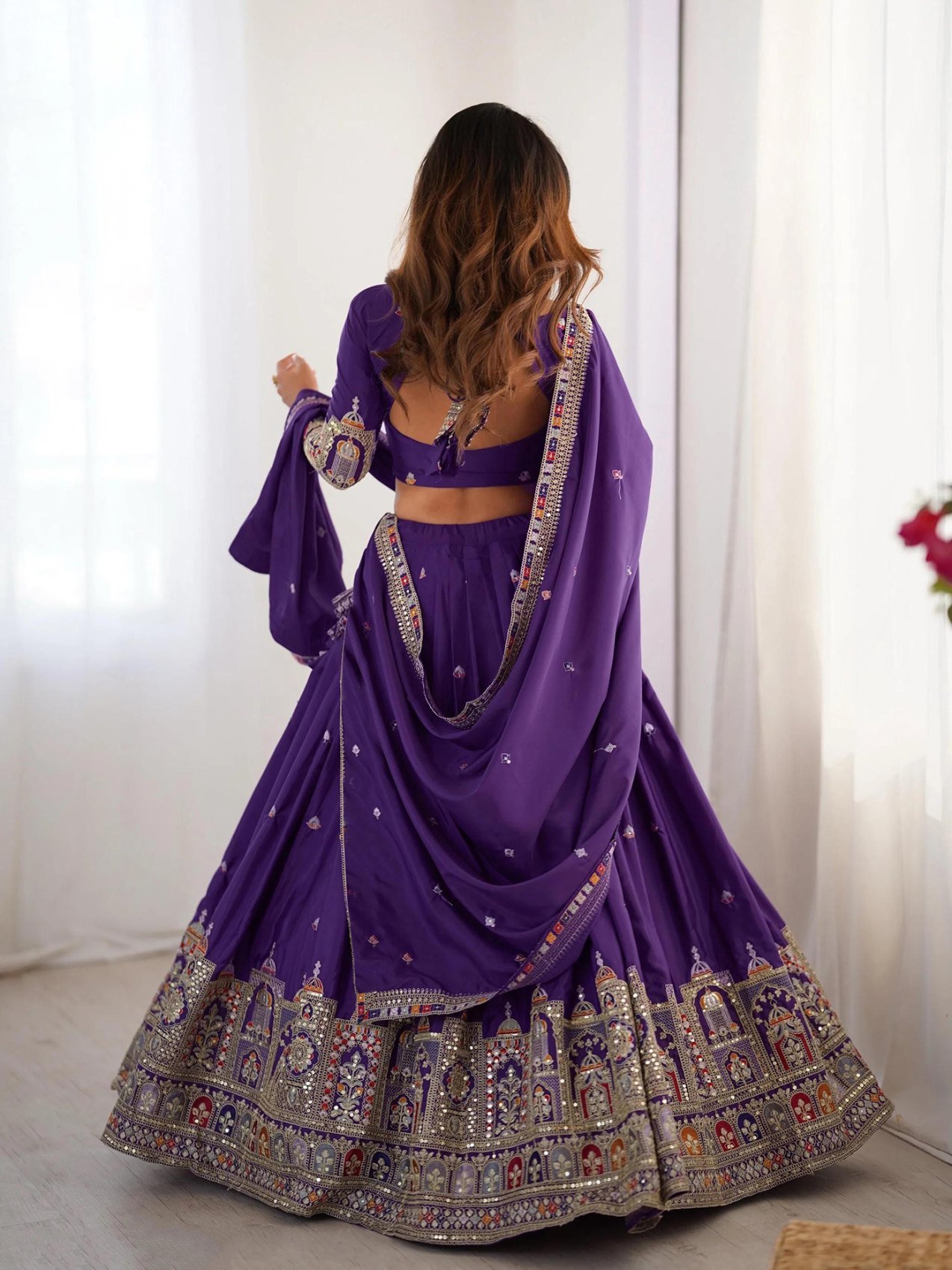 Purple embroidered Chinon semi-stitched lehenga choli set with dupatta, styled view