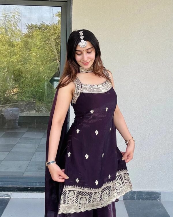 Model wearing the wine fandy kurta, palazzo & dupatta set, front view