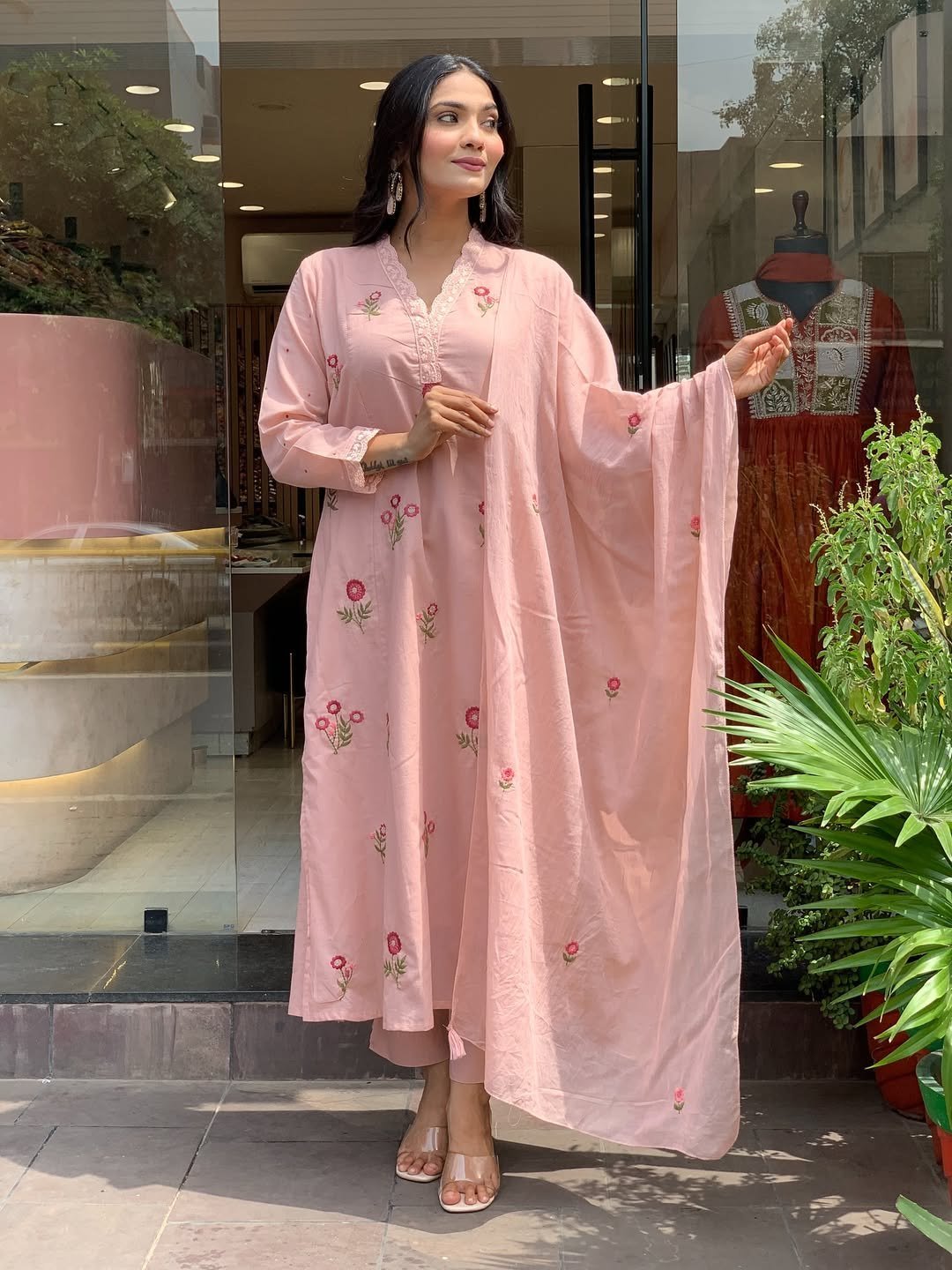 Front view of the peach flared kurta with matching pant