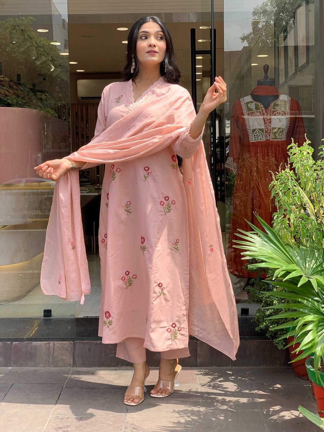Peach kurta set with the dupatta draped over one shoulder