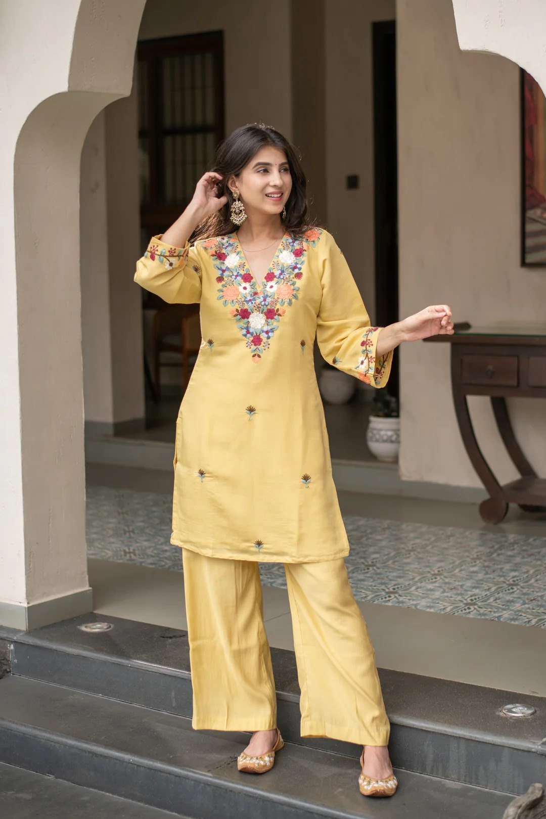 Front view of the yellow kurti and pant set