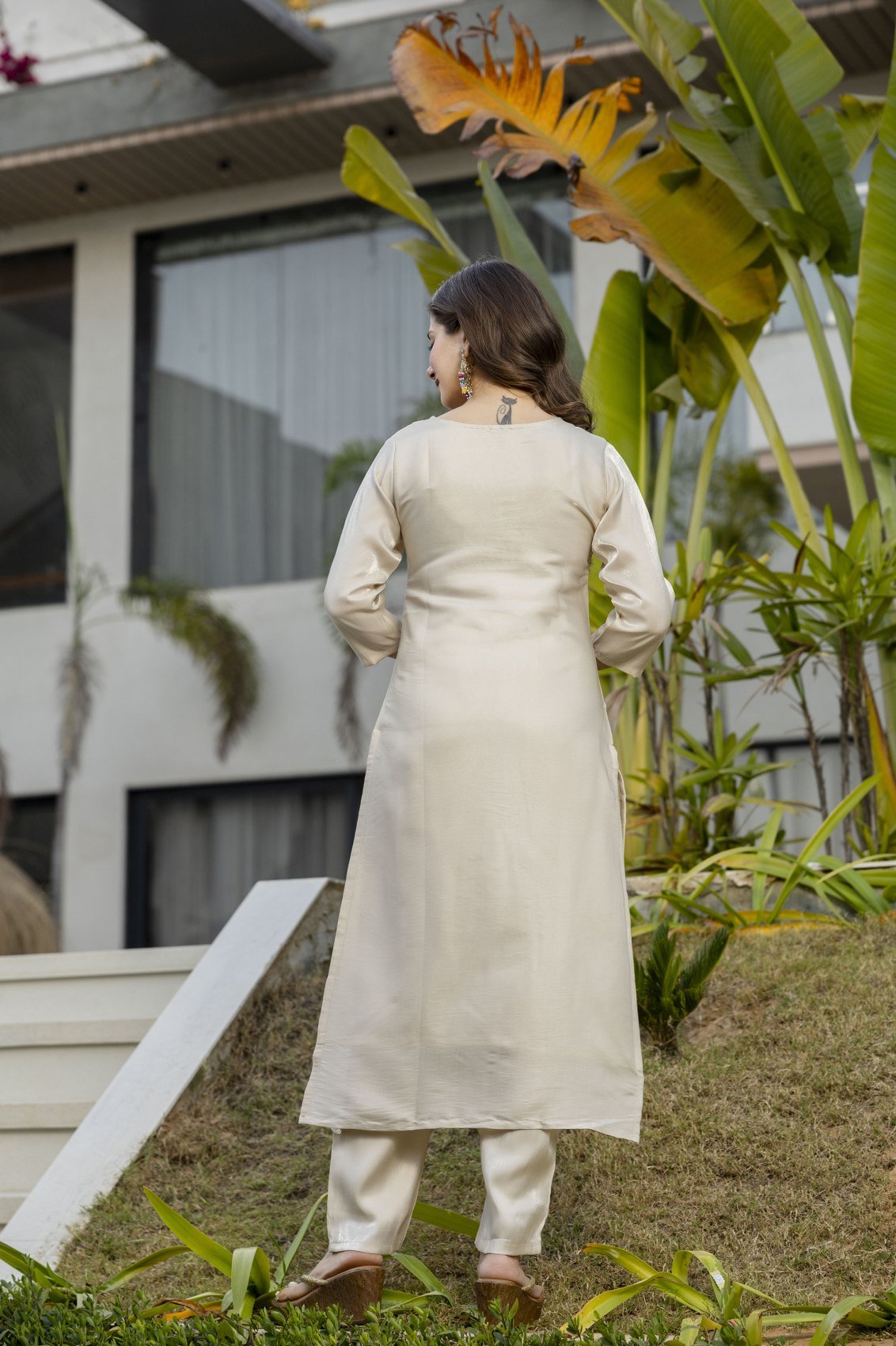 Back view of the cream viscose shimmer kurta and matching pant