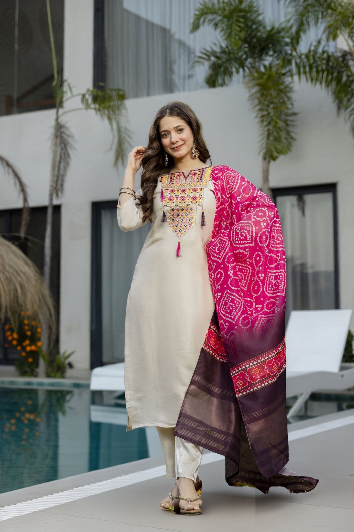 Front view of the cream kurta set with the dupatta draped