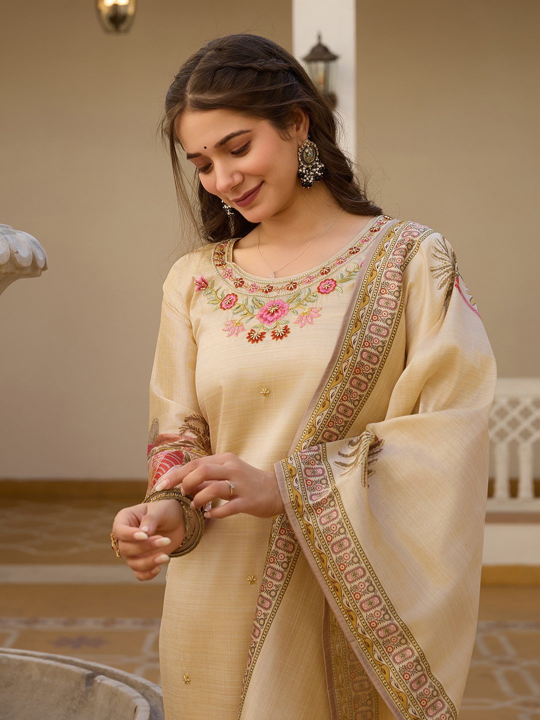 Beige Assam silk kurta set styled with the dupatta